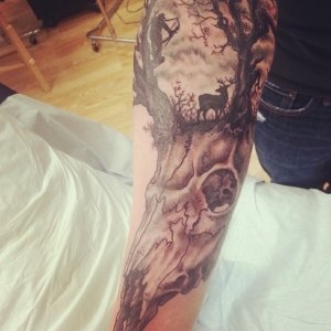 Forearm deer and bow hunter tattoo
